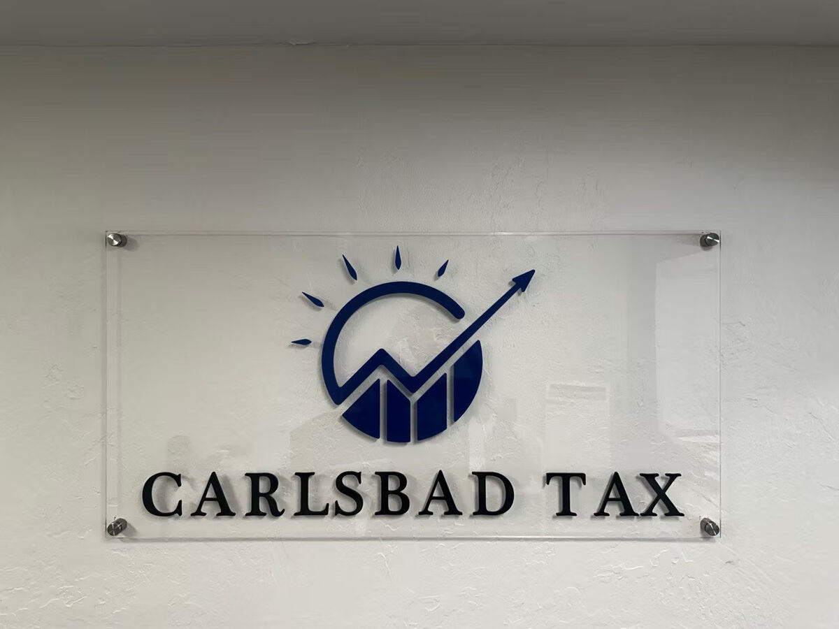 Carlsbad Tax lobby sign: clear acrylic panel with a blue dimensional logo